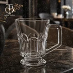 لیوان دسته دار شفاف از جنس بلور مدل KTZB117 برند بلینک مکس روی یک میز