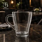 لیوان دسته دار شفاف از جنس بلور مدل KTZB-21-1 برند بلینک مکس روی یک میز