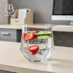 لیوان شیشه ای از جنس بلور مدل KTY6238-1 از برند بلینک مکس روی میز MDF